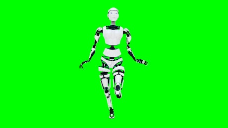 Android walking robotically against a green screen.