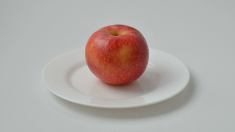 Apple in stop motion filling with bites