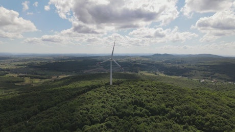Approaching a wind turbine, aerial shot
