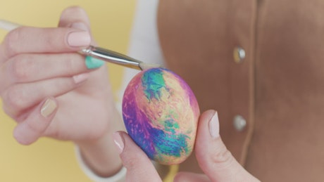 Artist decorating Easter eggs.
