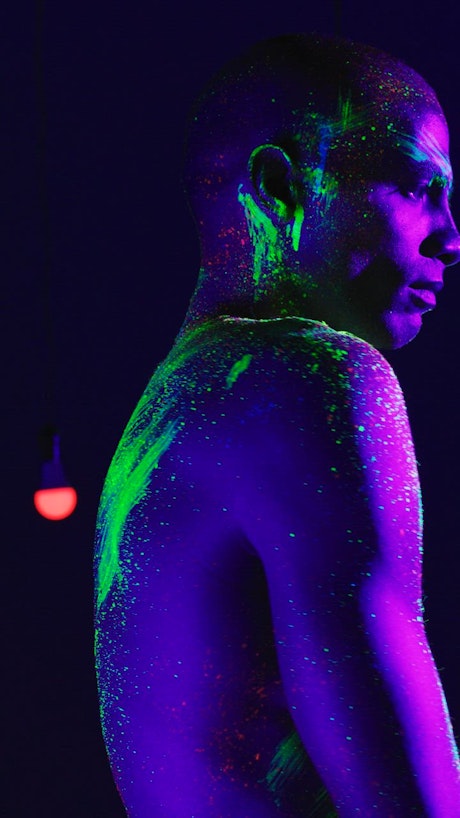Artistic portrait of a man stained with phosphorescent.