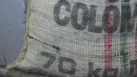 Bag of coffee grains in a factory.