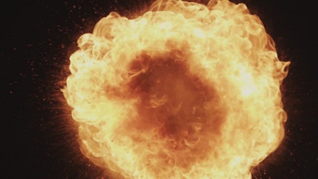 Ball of fire blasting on a black background.