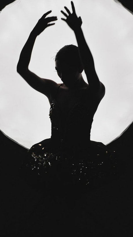 Ballerina silhouette while dancing.