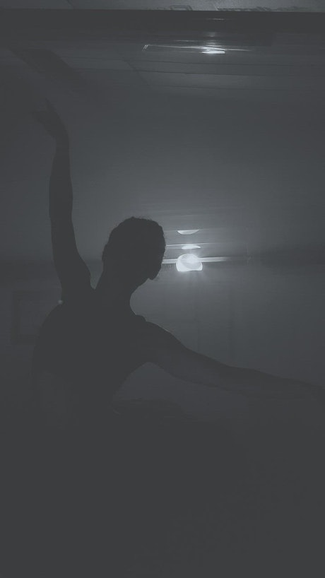 Ballet dancer in the dark.