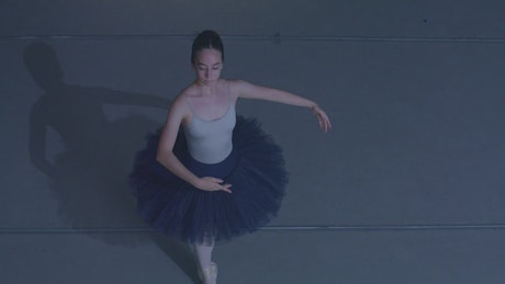 Ballet dancer twirling on toes.