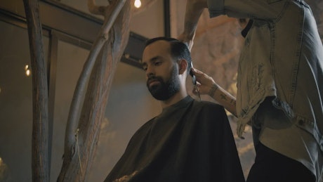 Barber cutting a man's hair.