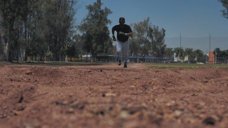 Baseball player slides into base..