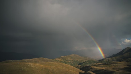 Beautiful rainbow in the mountain landscape