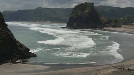 Big beach and lion shaped rock in New Zealand