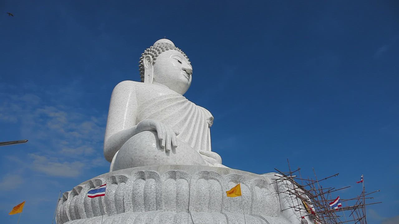 Big Buddha  monument  with flags Free Stock Video Mixkit