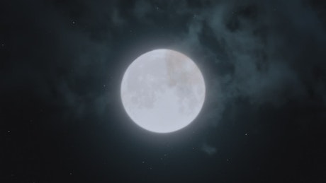 Big full moon on a cloudy night.