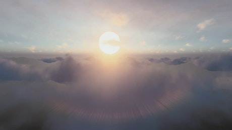 Big sun over the a clouds layer.