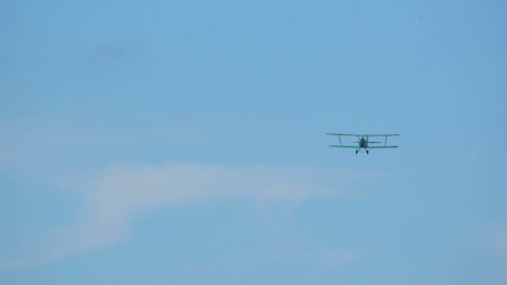 Biplane flying in the sky.