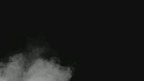 Black background with smoke at the bottom