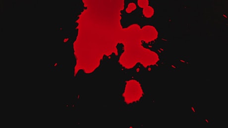 Blood drops on black background