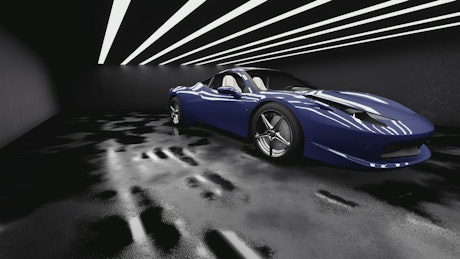 Blue luxury sports car in a garage.
