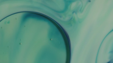 Bluish liquid in motion in the background