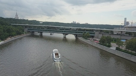 Boat heading through a river in Moscow.