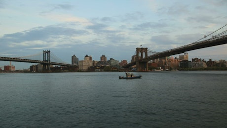 Boat under the Brooklyn bridge