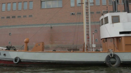 Boats docked along a river in Hamburg.