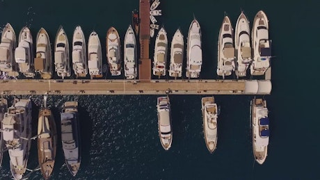Boats lined up in a Marina.