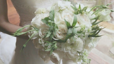 Bouquets of flowers carried by a bride at her wedding.