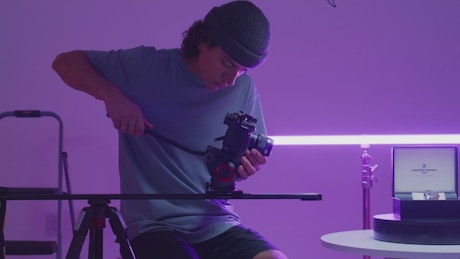 Boy recording a promotional video of a watch.