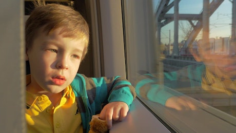 Boy travelling on a train through Russia.