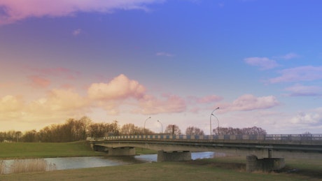 Bridge with traffic in the countryside at sunset