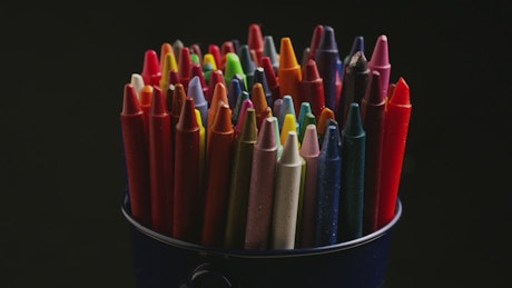 Bucket of crayons for arts and crafts.