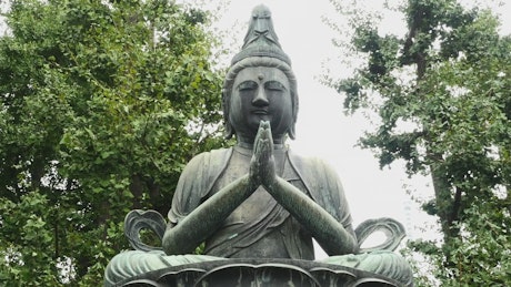 Buddha statue in the garden of a Japanese temple.