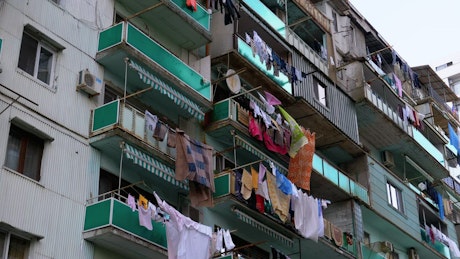 Building with clothes hanging in the balcony.