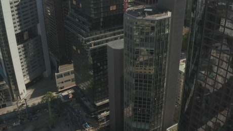 Buildings and skyscrapers in an aerial close shot.