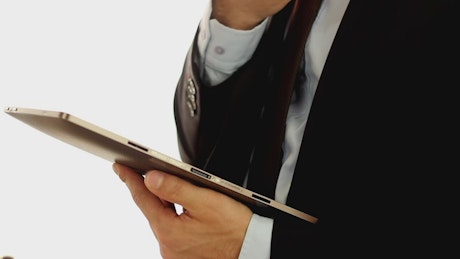 Businessman wearing a suit and using a tablet
