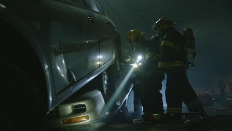 Car accident inside a tunnel with rescue team in action.