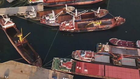 Cargo ships floating on a coast