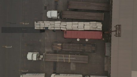 Cargo trucks in the warehouse parking lot.