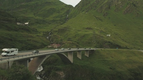 Cars driving over a bridge.