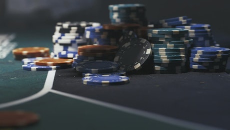Casino chips falling on the board.
