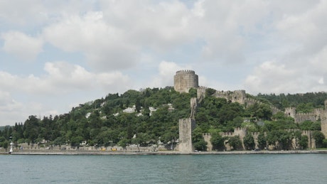 Castle fortress in the forest coast.