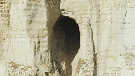 Cave entrance in the cliffs.