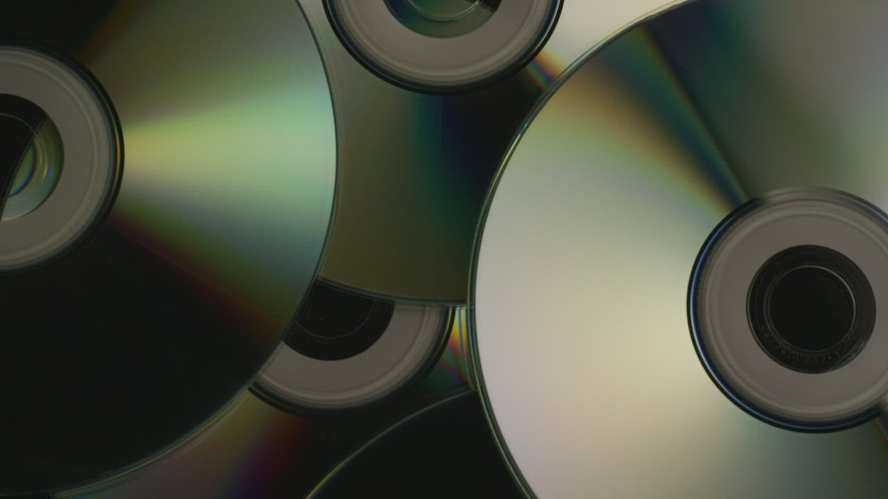 CDs slowly rotating, background video - Free Stock Video