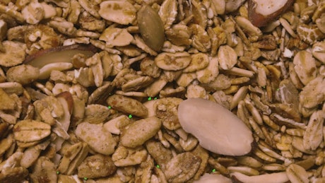 Cereal uncovering and covering a green background