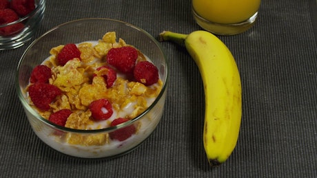 Cereal with berries and milk.