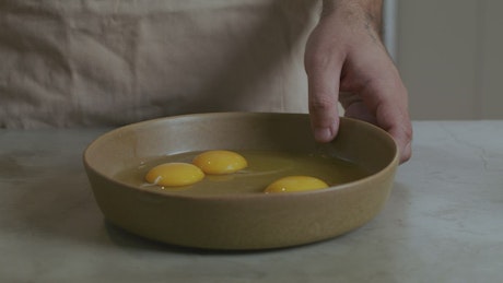 Chef beating eggs