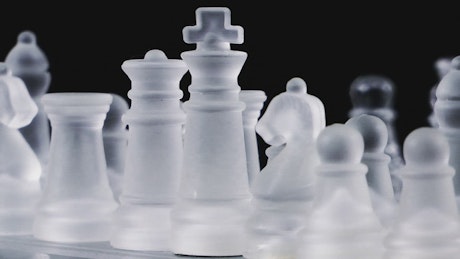 Chess with glass pieces.