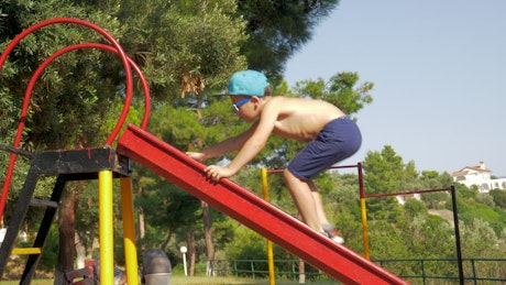 Child climbing in a park.