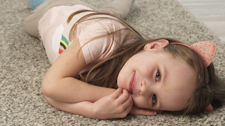 Child laying on the floor.