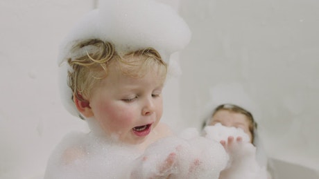 Children playing in the bath.